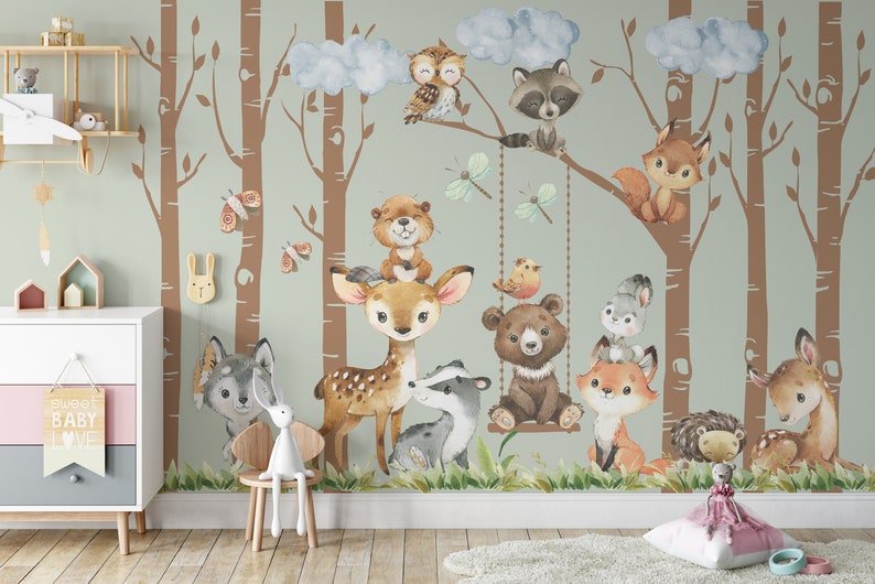 May include: A watercolor illustration of a woodland scene with a variety of animals, including a deer, a bear, a raccoon, a fox, a badger, an owl, and a squirrel. The animals are surrounded by trees and clouds. The illustration is in a light green and brown color scheme.