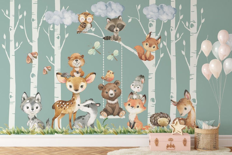 May include: A watercolor mural featuring a woodland scene with a variety of animals, including a deer, fox, raccoon, owl, bear, and squirrel. The mural is set against a backdrop of birch trees and clouds. There are also several balloons in the background.