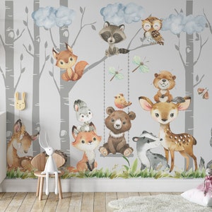 May include: A watercolor mural featuring a gray and white birch forest with various woodland animals, including a fox, deer, bear, raccoon, owl, and wolf. The mural is painted on a light gray background and includes clouds and butterflies.