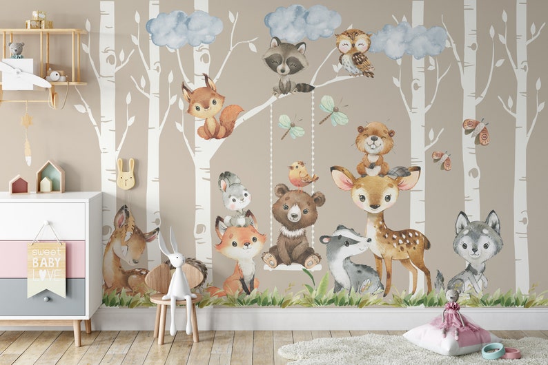 May include: A watercolor illustration of a woodland scene with various animals, including a fox, deer, bear, raccoon, owl, and wolf. The animals are depicted in a whimsical style with bright colors and playful expressions. The background features a birch tree forest with clouds and butterflies.