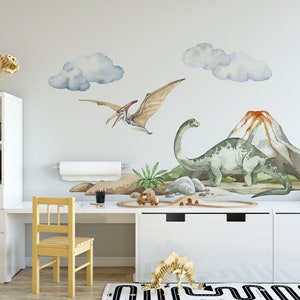 May include: A children's room decorated with dinosaur wall decals. The decals feature a green dinosaur, a flying dinosaur, and a volcano. There are also clouds and a small palm tree.