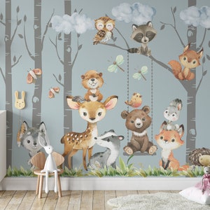 May include: A watercolor-style mural featuring a woodland scene with various animals, including a deer, bear, raccoon, owl, fox, and squirrel. The mural is set against a light blue background with gray birch trees.