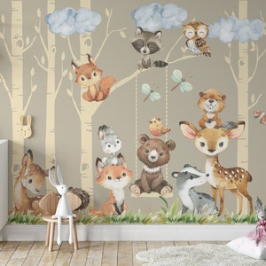 May include: A watercolor illustration of a woodland scene with a variety of animals, including a deer, a fox, a bear, a raccoon, an owl, and a squirrel. The animals are depicted in a whimsical style and are surrounded by trees and clouds. The illustration is perfect for a nursery or children's room.