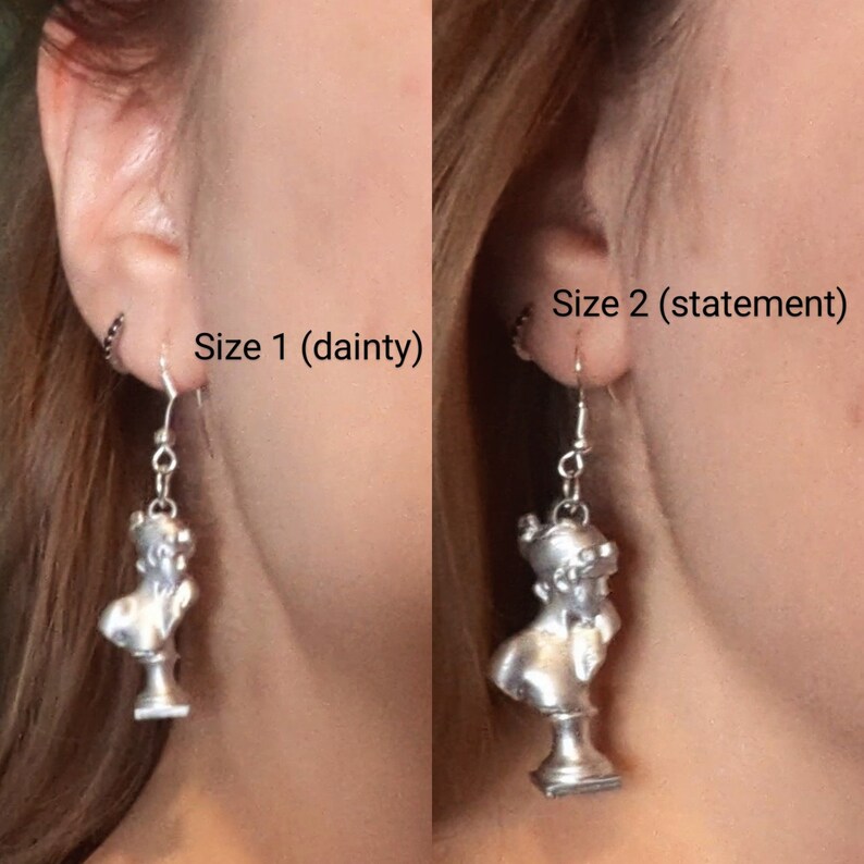 This photo shows a side-by-side of a blonde woman wearing a Sappho bust earring in the dainty size and the statement size.