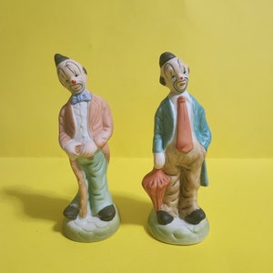 Set of 2 Ceramic/Porcelain Clown Figurines, One Holding an Umbrella and the Other Cane  **Free Shipping**