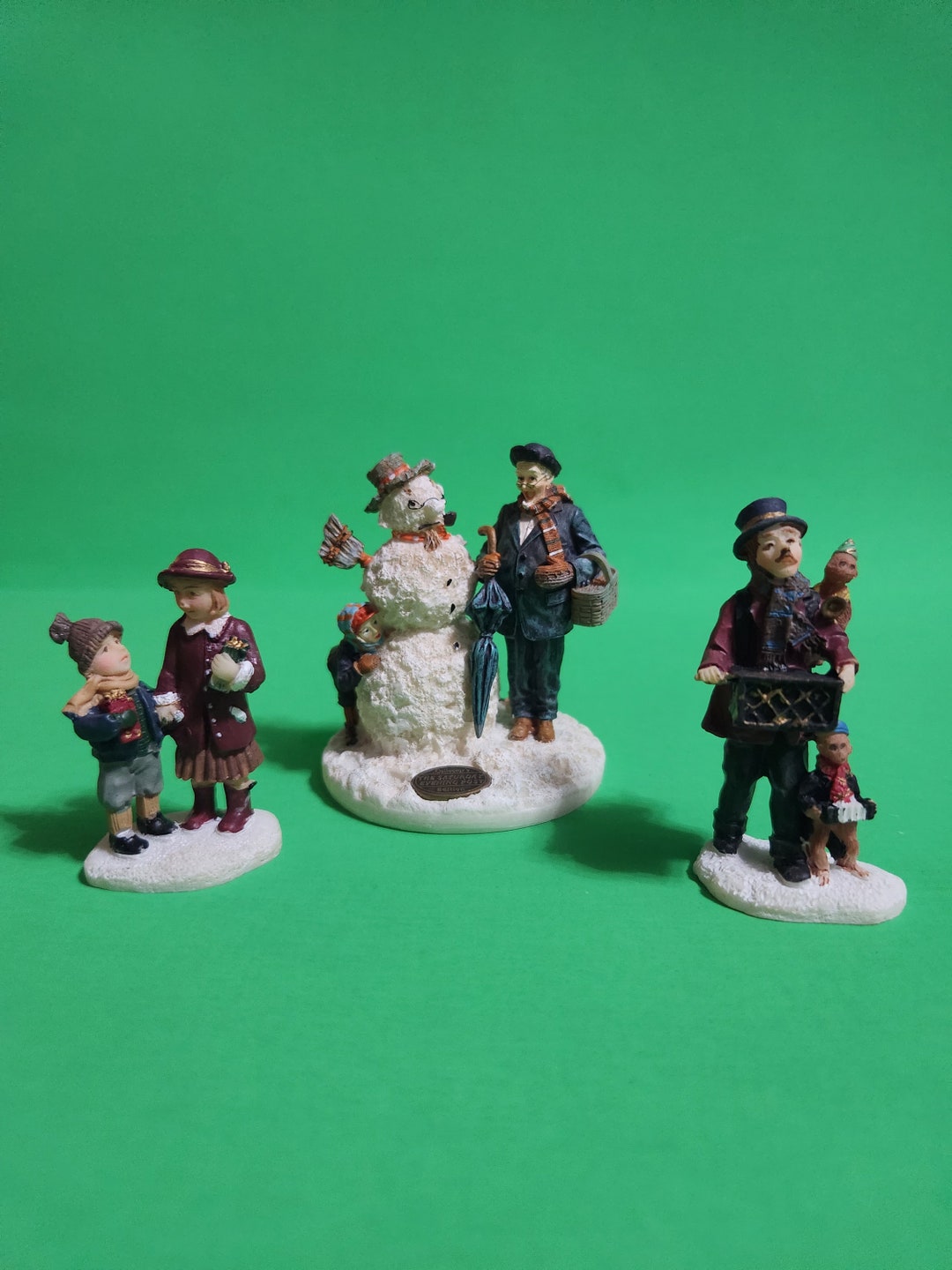 Set of 3 Figurines for a Christmas Village a Musical Man With 2 Monkeys, 2 Children Holding