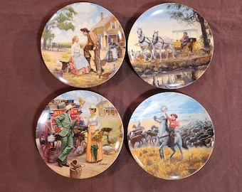 May include: Four decorative plates with Western-themed scenes. Each plate features a different pastoral image, including a couple, a horse-drawn carriage, a man in a green suit, and a cowboy on a horse herding cattle. The plates have a glossy finish.