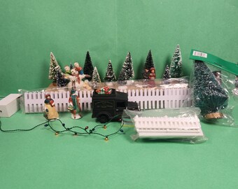 Conjunto de figuras y accesorios para un pueblo navideño (Conjunto 96)