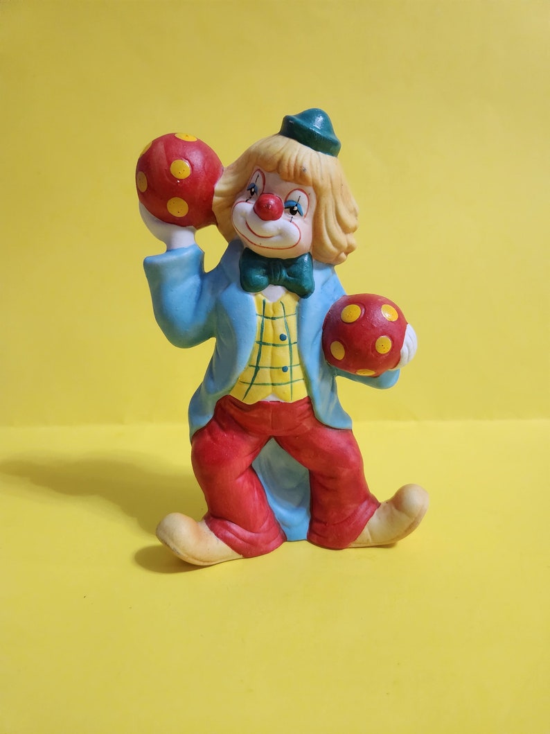 Enesco Ceramic/porcelain Clown Figurine Featuring a Clown Holding 2 Red
