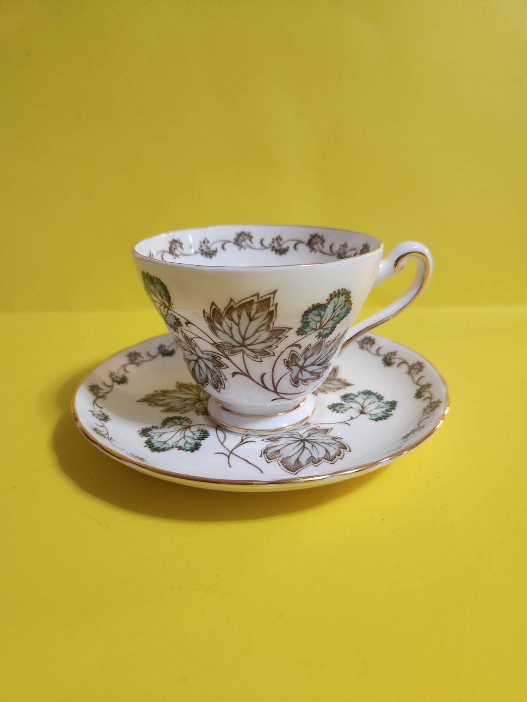 Tuscan Fine English Bone China Teacup and Saucer Set Featuring a Green and Brown Leaf Design and