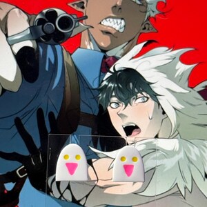 May include: A pair of white stud earrings shaped like ghosts with two yellow circular eyes and a pink triangular mouth, displayed on a clear acrylic card against a background featuring an illustration of two anime characters.
