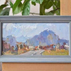 Original mountain landscape oil painting in a frame. Contemporary framed wall art. Landscape with a road in the mountains. European fine art