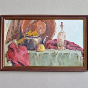 Large framed still life oil painting on canvas. Kitchen still life with a teapot, bottle and draperies. European fine art. One of a kind