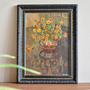 Original vintage still life oil painting with flowers in an antique frame. Unique ancient art of the first half of the 20th century. Retro