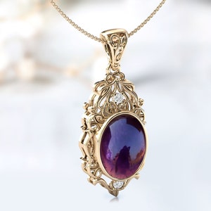 May include: A gold pendant necklace with an oval amethyst gemstone surrounded by a filigree design and small diamonds.