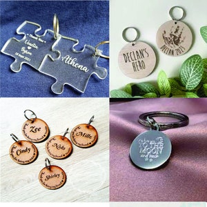 May include: A selection of personalised wooden and acrylic keyrings with engraved messages. Some keyrings feature names, dates, and messages such as "Thank you for being my friend" and "I love you to the moon and back".