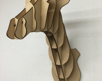 May include: A wooden giraffe head wall decor made of layered plywood. The giraffe head is brown and has a long neck.