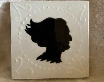 Handmade stoneware tile with silhouette