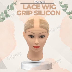 May include: The new Lace Wig Grip Silicon is a wig grip that helps to secure a wig to the head. It is made of silicone and has a lace design. The grip is shown on a mannequin head.