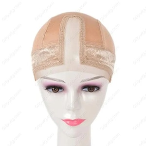 May include: A beige wig cap with a lace front and a middle part. The cap is made of a breathable material and is designed to fit comfortably on the head.