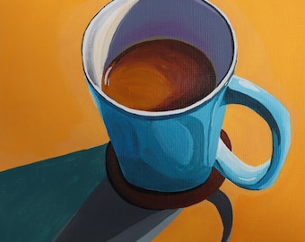 May include: A blue ceramic mug with a brown coffee or tea inside, sitting on a brown coaster. The mug is on a yellow surface.