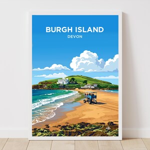May include: A framed art print depicting Burgh Island, Devon. The image shows a beach with a green island, blue sky, and white clouds. The text "Burgh Island Devon" is at the top of the print.
