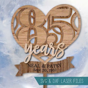 May include: A wooden heart-shaped cake topper with the numbers 65 inside and the word "years" below. A banner below the heart reads "NEAL & PATSY Sept 20, 1957". The text "SVG & DXF LASER FILES" is at the bottom of the image.