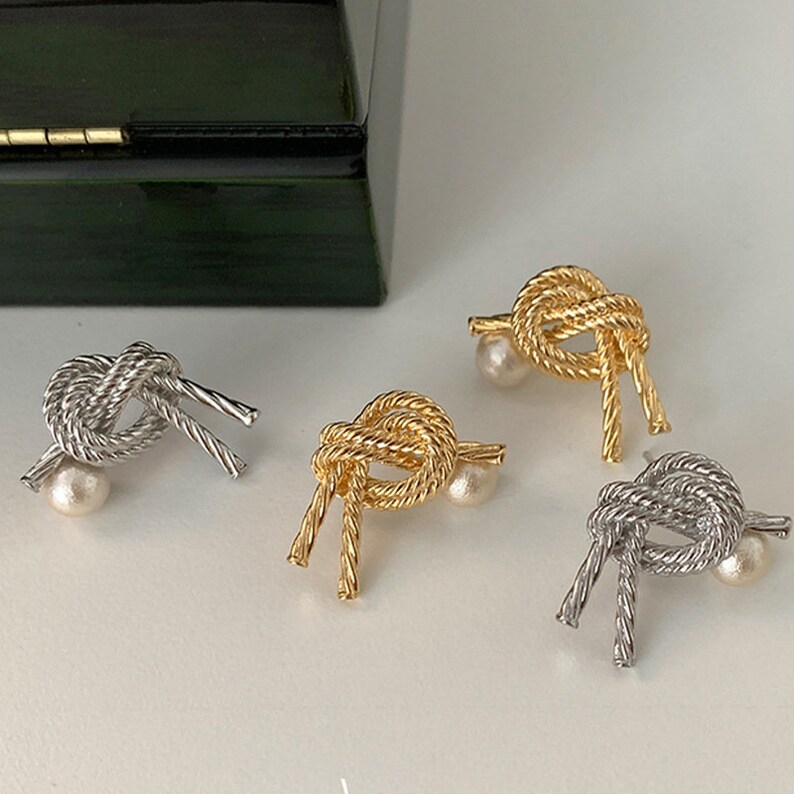 Twisted knot stud earrings with pearl drop main image 1