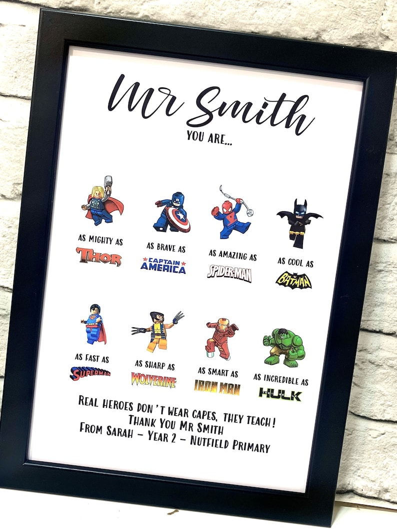 May include: Framed print with black border. The print features the text "Mr Smith, YOU ARE..." with superhero illustrations and phrases like "As Mighty As Thor" and "Real heroes don't wear capes, they teach!"