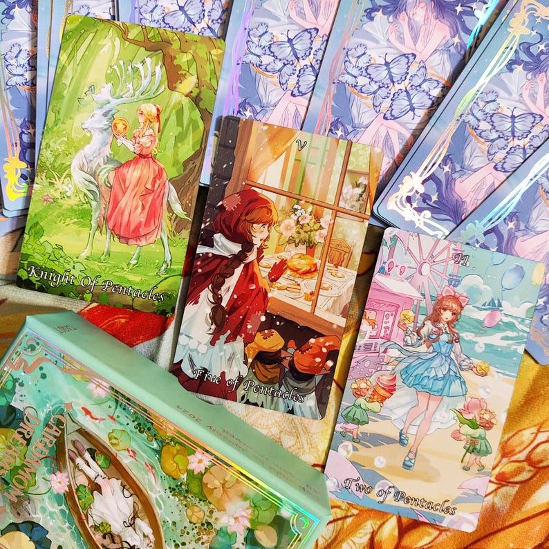 May include: A set of tarot cards featuring illustrations of people and animals. The cards are colorful and have a whimsical style. The cards include the Knight of Pentacles, Five of Pentacles, and Two of Pentacles.