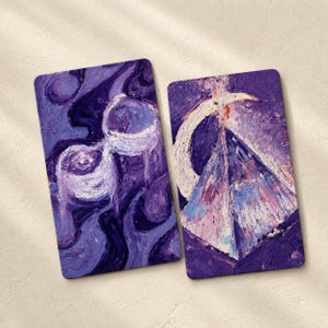May include: Two rectangular art prints with rounded corners. One features a swirling, abstract design in shades of purple and white. The other depicts a pyramid with a crescent moon and a cross, in purple, white, pink, and blue.
