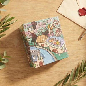 May include: A set of three ceramic mugs with a speckled, matte finish. The mugs are in shades of cream, light gray, and dark gray. Each mug has a simple, minimalist design, perfect for coffee or tea.