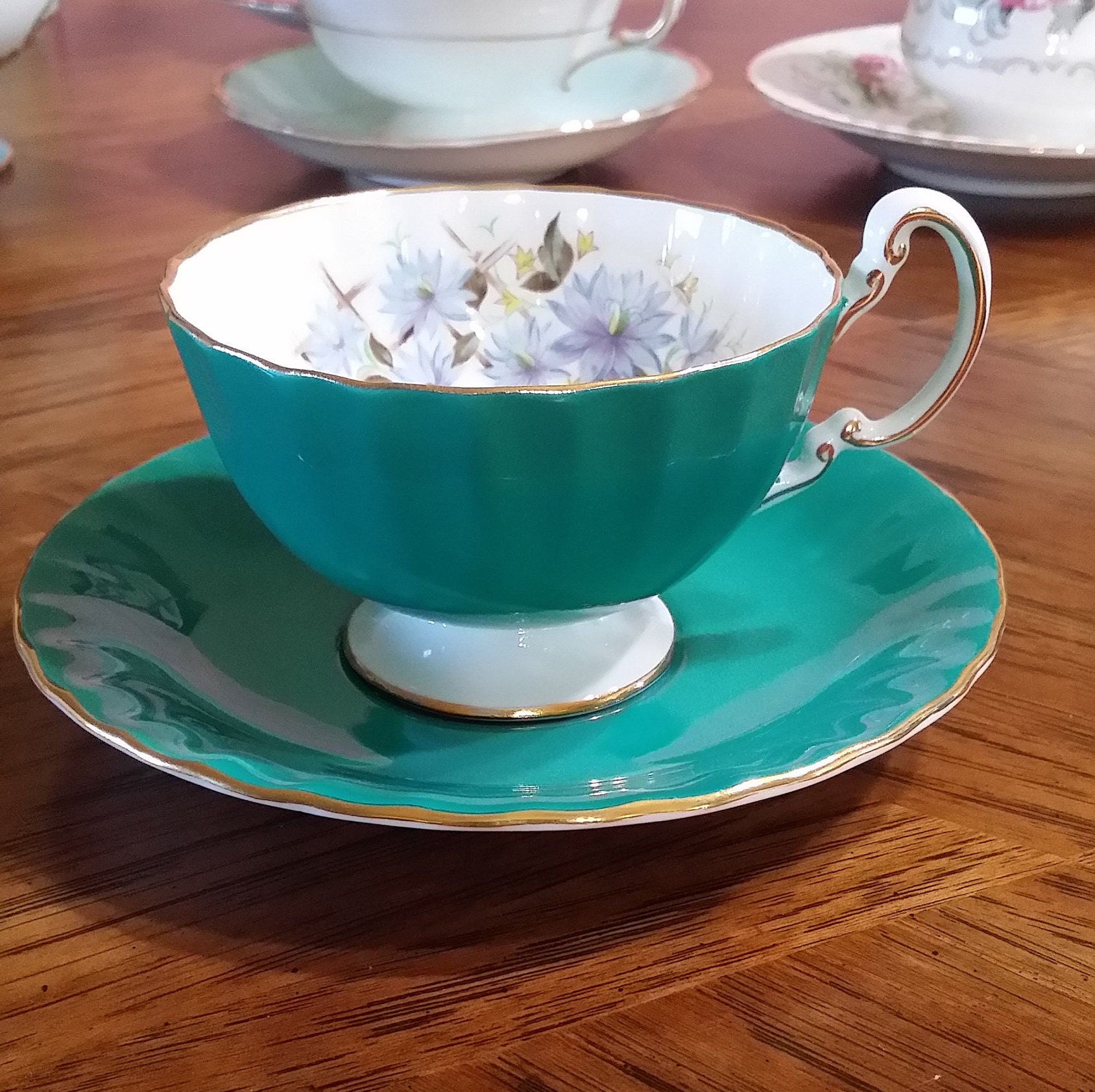 Aynsley Green Tea Cup and Saucer With Sprays of Blue Flowers on