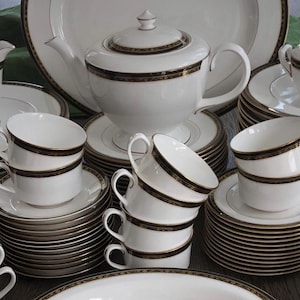 Royal Worcester 1986 (83 pc.) Odette Dinner Service for 12 plus Serving Pieces.  Fine Bone English China. Black, Gold accents. As knew. Gift
