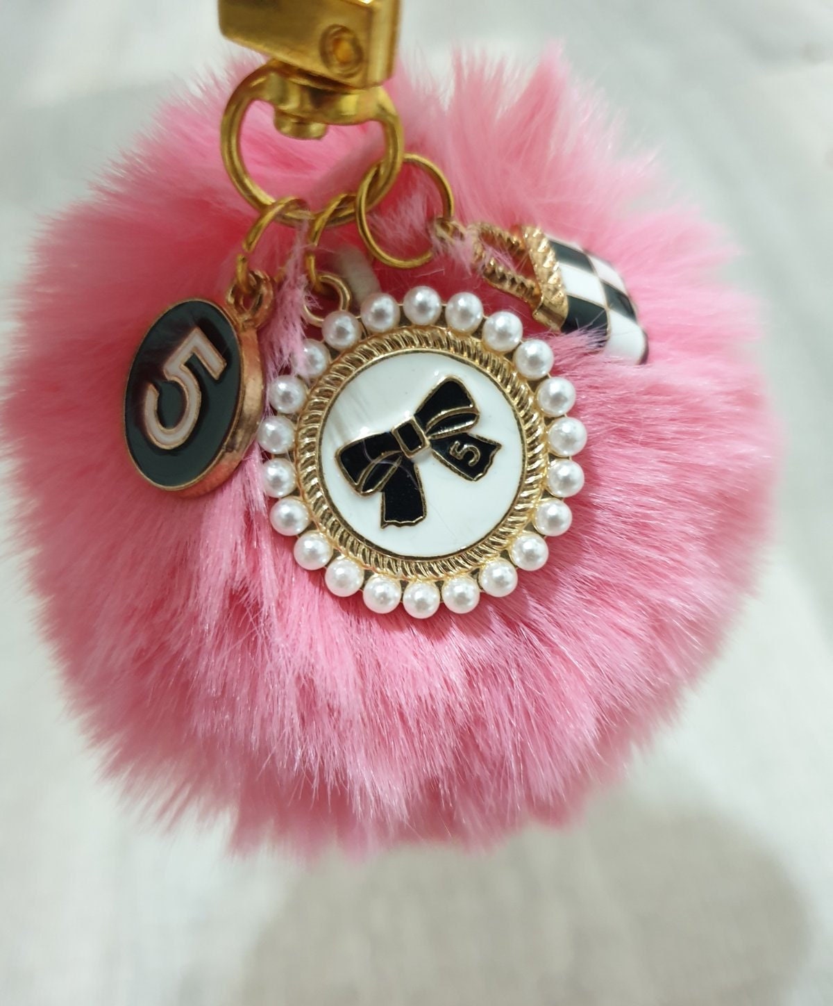 lv pom pom keychain