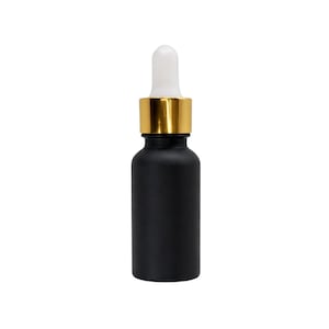 May include: A black glass dropper bottle with a gold collar and white dropper. The bottle is cylindrical and opaque, with a matte finish. The dropper has a white bulb. The bottle is designed for dispensing liquids.