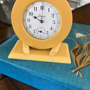 Heavy Queen Celluloid Clock