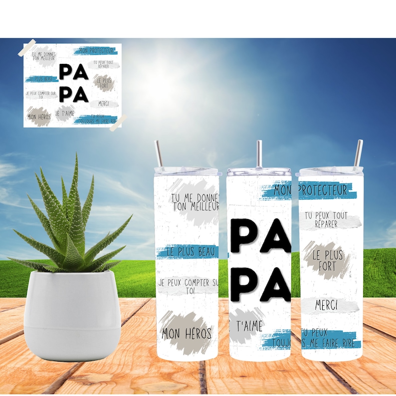 May include: Three stainless steel tumblers with a white background and blue accents. The tumblers feature the word "Papa" in black lettering and various phrases in French, such as "Tu me donne ton meilleur", "Le plus beau", "Je peux compter sur toi", "Mon heros", "Mon protecteur", "Tu peux tout reparer", "Le plus fort", "Merci", "T'aime", "Tu peux me faire rire".
