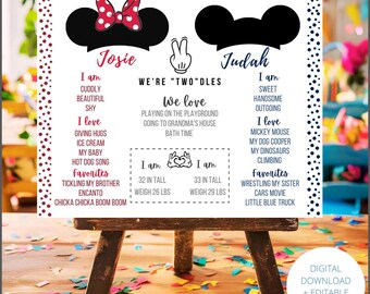 May include: A personalized birthday party sign on a small wooden easel. The sign features black Mickey Mouse ears, a red bow, and text with the names "Josie" and "Judah". The sign includes the text "We're Two Dles" and lists favorite things.