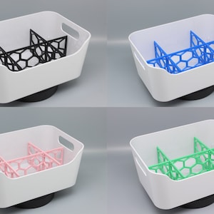 May include: Four white plastic baskets with different colored dividers. The dividers are made of a honeycomb pattern. The baskets are all the same size and shape. The dividers are black, blue, pink, and green.
