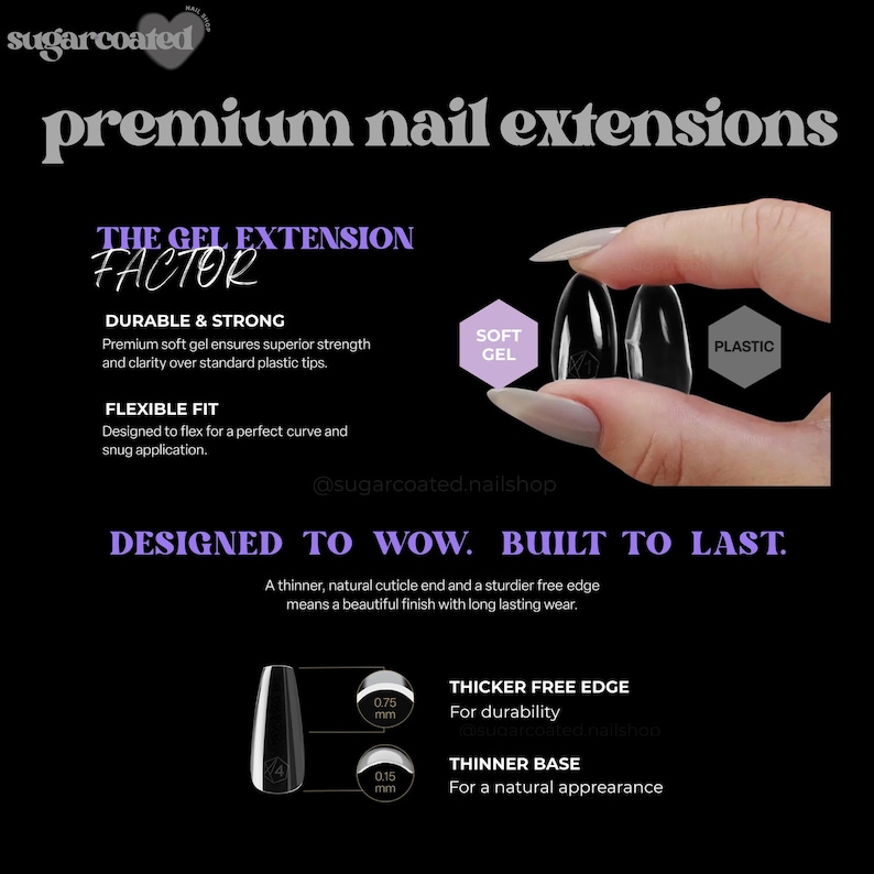 a woman's hand holding a black and white nail