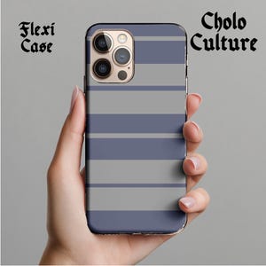 May include: A blue and gray striped phone case with the text "Cholo Culture" printed on it. The case is designed for a phone with a camera bump.