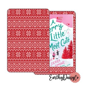 May include: A book cover with the title "A Merry Little Meet Cute" and the author's name, featuring a couple, Christmas trees, and a film reel. The cover is next to a matching red and white patterned case with a festive design.