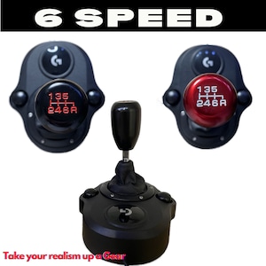 May include: A black 6-speed manual shifter with a red gear pattern. The shifter has a black leather gaiter and a black knob. The shifter is mounted on a black base with a black button. The base has a black gear pattern on it. The shifter is labelled "6 SPEED".