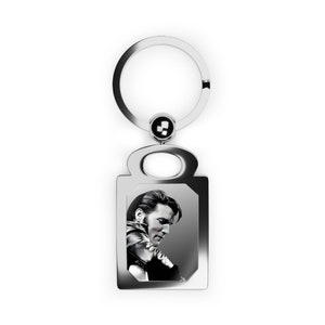 Elvis. Elvis Presley playing guitar in black and white in a rectangle photo keyring