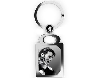 Elvis. Elvis Presley playing guitar in black and white in a rectangle photo keyring