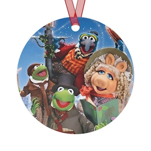 Disney The Muppets Christmas Carol metal ornament featuring Kermit the Frog, Miss Piggy and Gonzo.