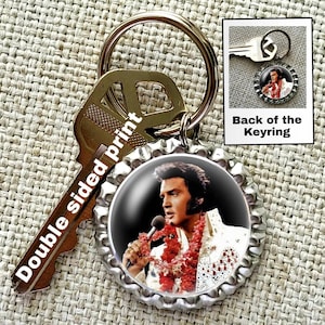 May include: A silver bottle cap keychain with a photo of Elvis Presley singing into a microphone. The keychain is attached to a gold key ring and a gold key. The text "Double sided print" is written on the key. The back of the keychain is shown in a smaller image.