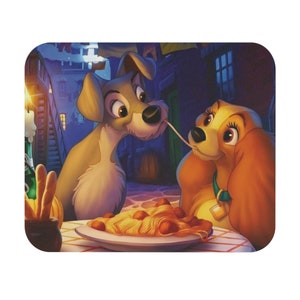 Disney&#39;s Lady and the Tramp mouse pad. Lady and the Tramp eating spaguetti scene from the classic Disney 1955 film.
