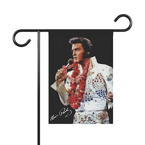 Elvis Presley. Elvis Presley in concert singing Garden & House Banner or flag with his signature.